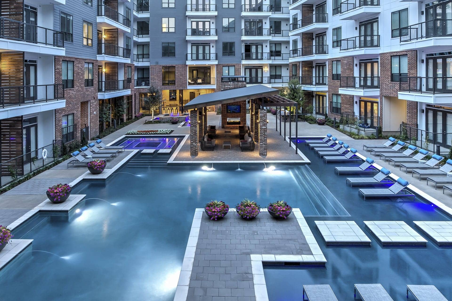 Swimming pool with lounge chairs at Windsor Fitzhugh, TX, 75206