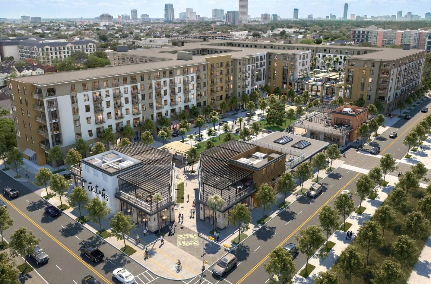Aerial view of Allen House Apartments, a modern urban development with mid-rise buildings, landscaped courtyards, and retail spaces along tree-lined streets, with city skyscrapers visible in the distant background.